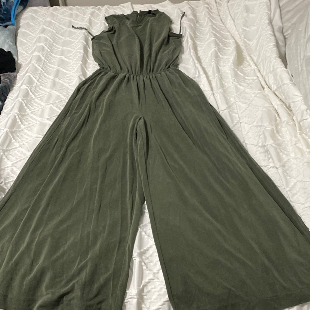 Green jumpsuit stretchy cinched waist. Sleeveless. Long and wide bottoms
